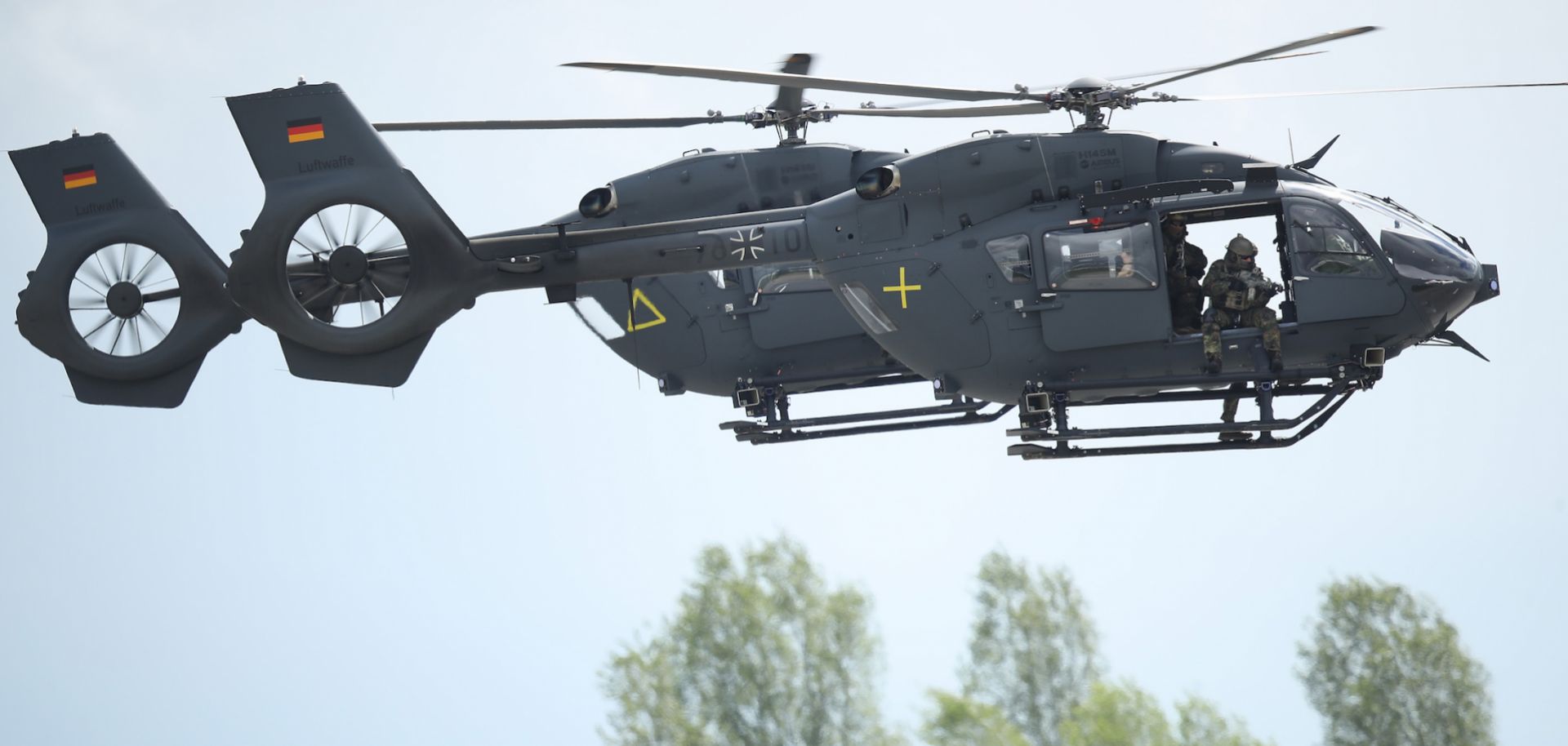 Germany's armed forces, the Bundeswehr, conduct a special forces simulation with two Airbus H145M helicopters at an air show in Schoenefeld, Germany, in April 2018.