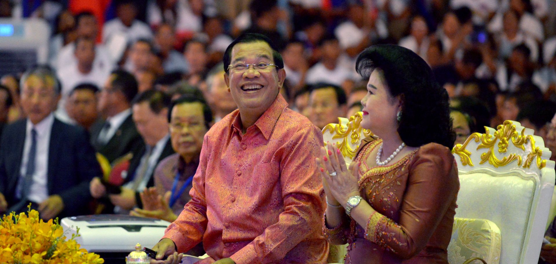 Cambodian Prime Minister Hun Sen (L) and his wife look on during a ceremony at the Olympic national stadium in Phnom Penh on July 17, 2017. 
