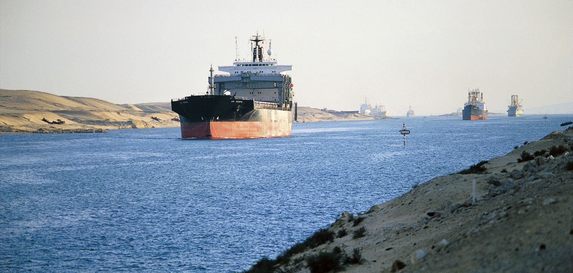 Cargo ship transits the Suez Canal.