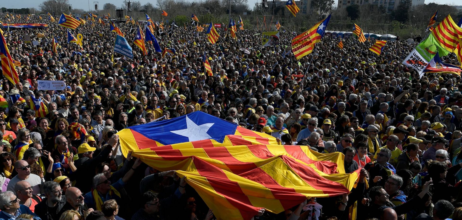 Demonstrators hold a Catalonian flag ahead of a political meeting in Perpignan, France, on Feb. 29, 2020. 