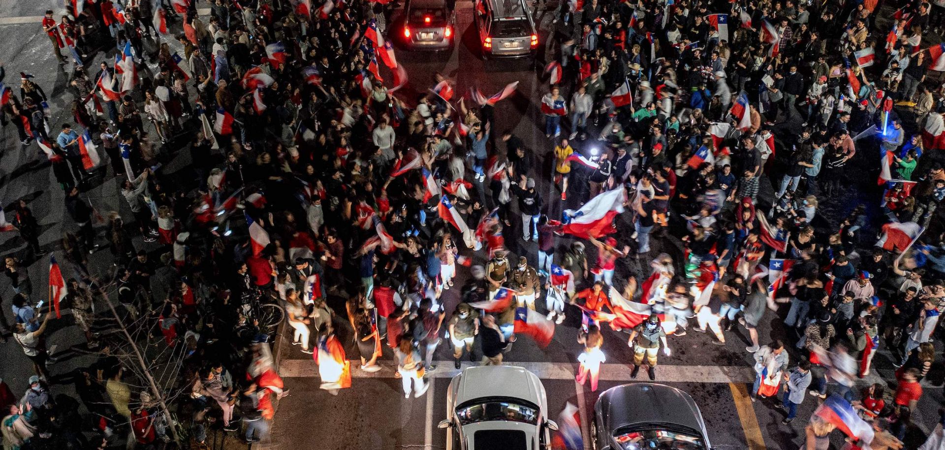 People opposed to Chile's proposed new constitution celebrate in the streets of Santiago on Sept. 4, 2022, after the first results of the referendum showed the number of ''no'' votes far exceeding the number of ''yes'' votes. 