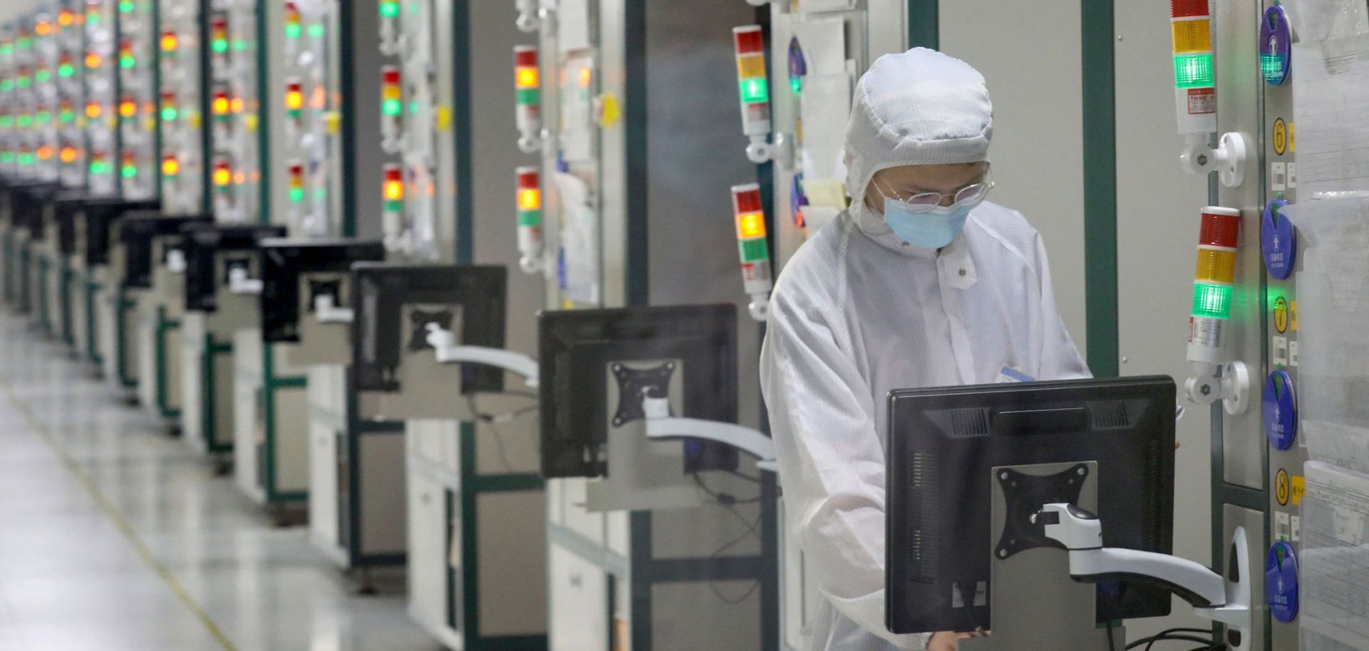 An employee works at a Jiangsu JieJie Microelectronics Co. Ltd. factory in Nantong, a city in eastern China's Jiangsu province on March 17, 2021. 