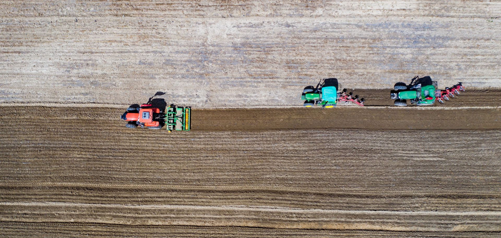 An aerial photo shows villagers sowing highland barley seeds with agricultural machinery in the fields in Lhasa, the capital of China's Tibet Autonomous Region, on April 22, 2020. 