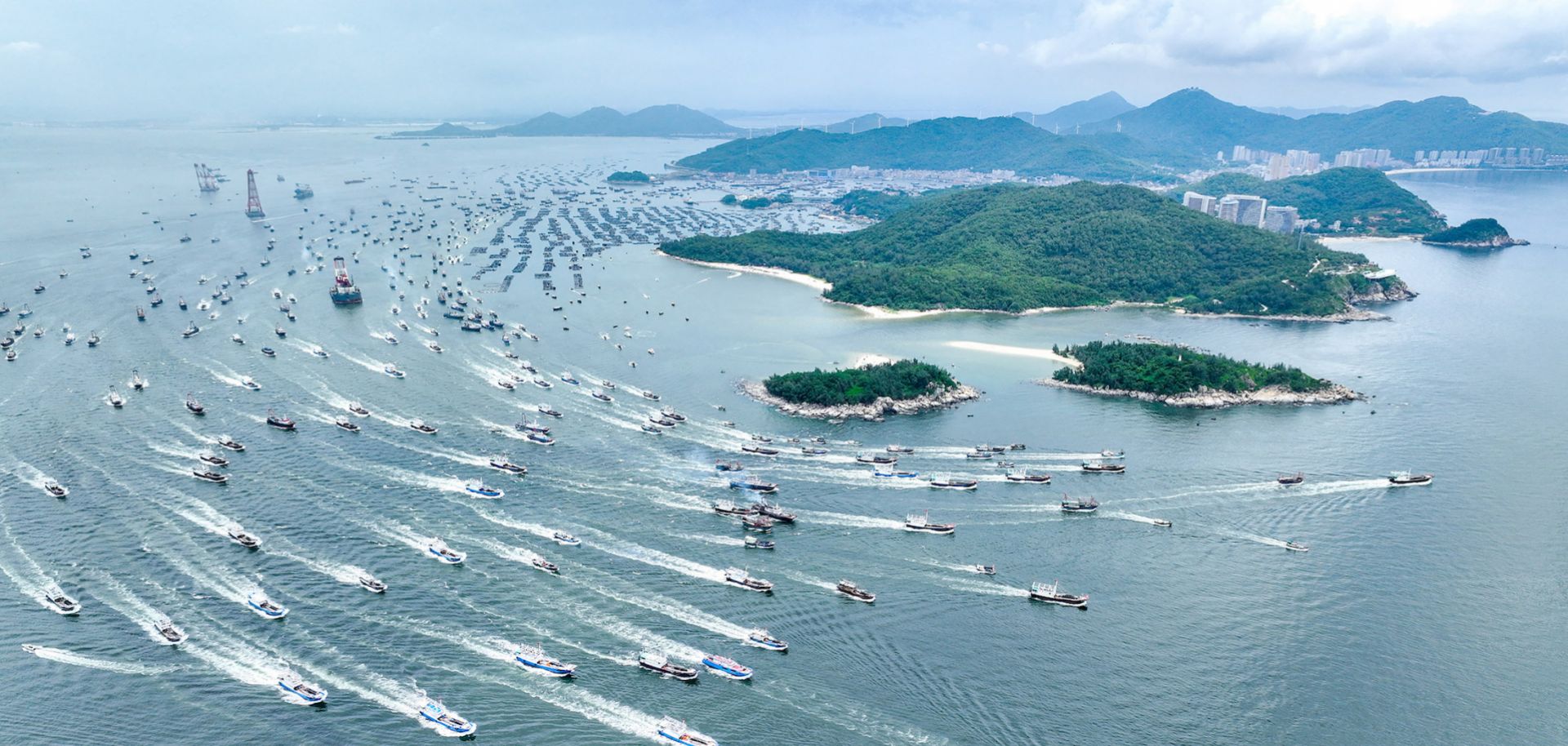 This aerial photo was taken on Aug. 16, 2022, and shows fishing boats heading out to sea on the first day of the fishing season in Yangjiang, in China's southern Guangdong province.