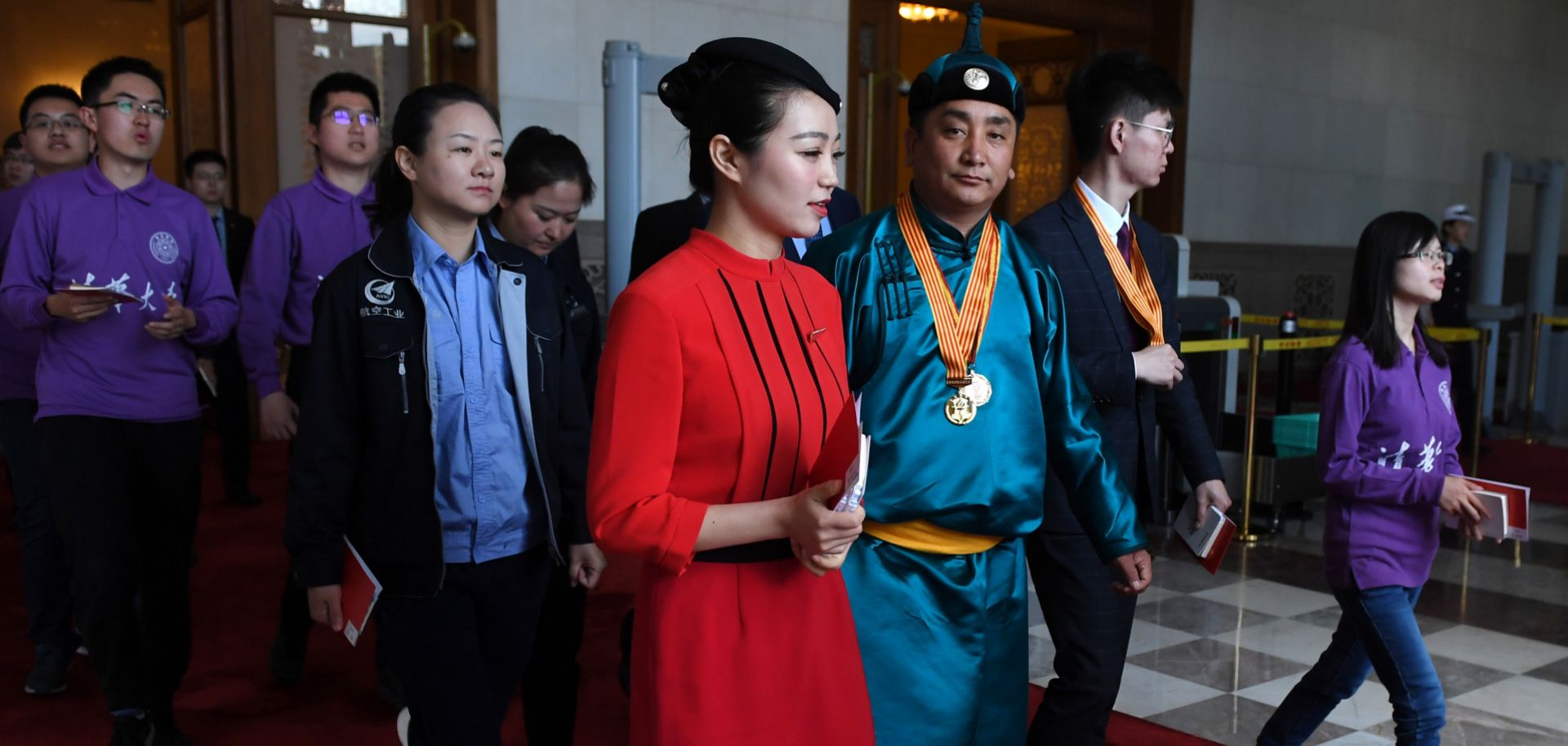 Guests leave a ceremony marking the 100th anniversary of China's May Fourth Movement against Western imperialism on April 30, 2019, in Beijing's Great Hall of the People.