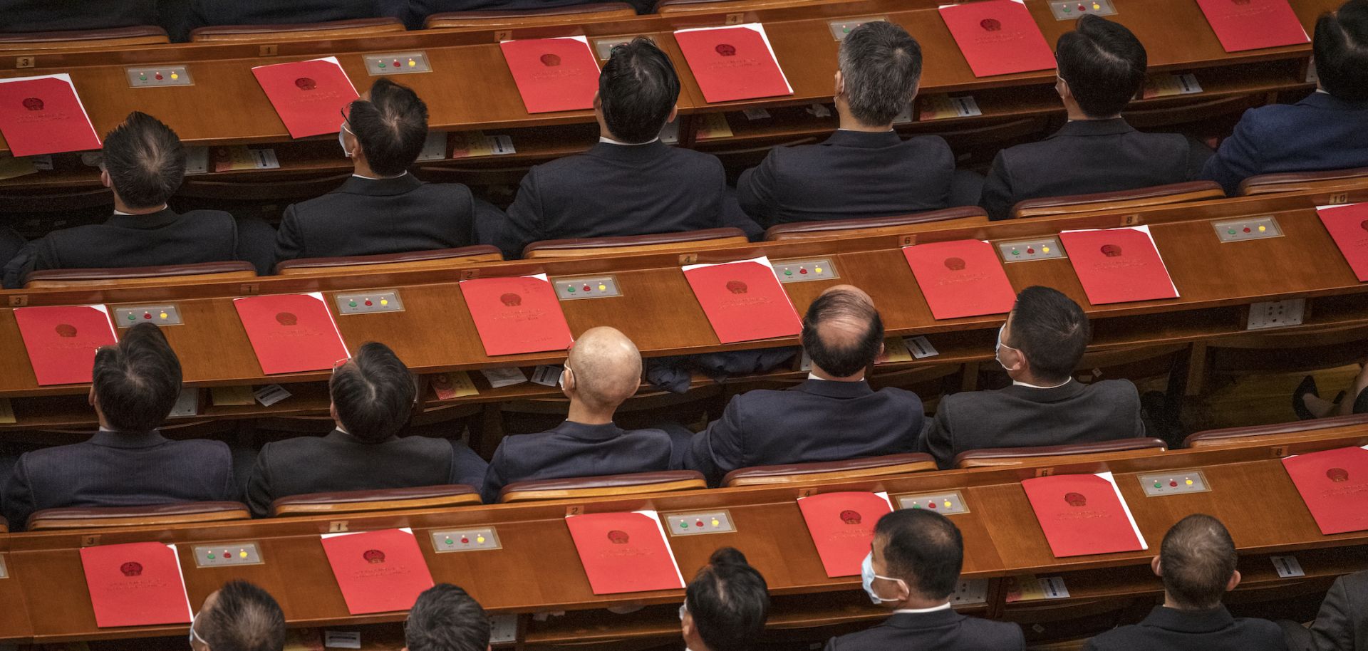 Delegates vote on resolutions during the closing session of China's National People's Congress on March 11, 2021.