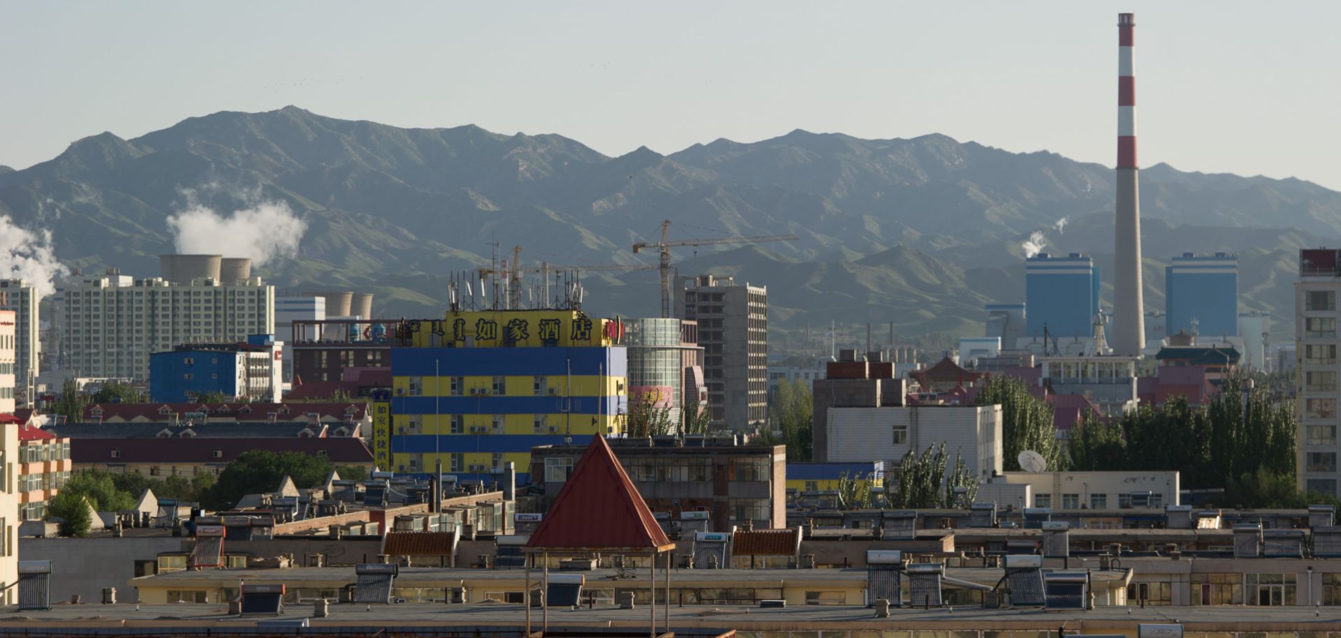 The skyline of the Inner Mongolian city of Baotou is blackened by pollution from factories processing rare earth elements, which are essential for the production of mobile phones and computers.