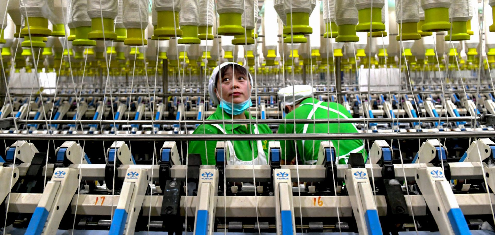 An employee works in a textile factory in Xiayi county in Shangqiu in China's central Henan province.