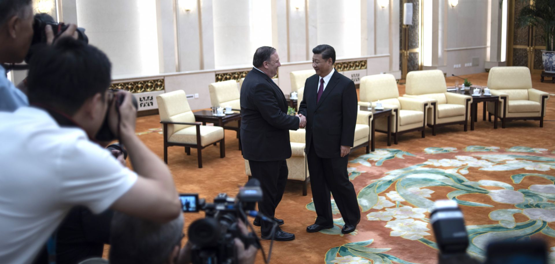 U.S. Secretary of State Mike Pompeo (L) shakes hands with Chinese President Xi Jinping during a meeting at the Great Hall of the People on June 14 in Beijing.