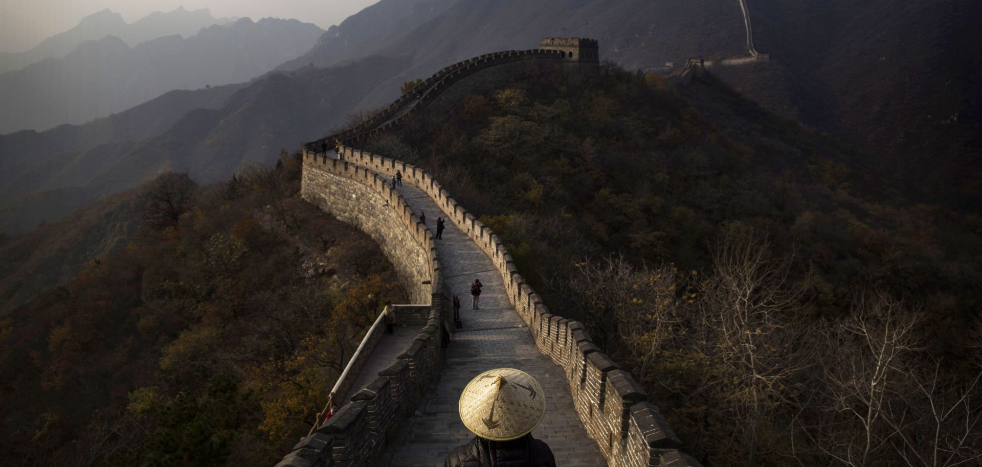 Tourists walk down part of the Great Wall of China. 