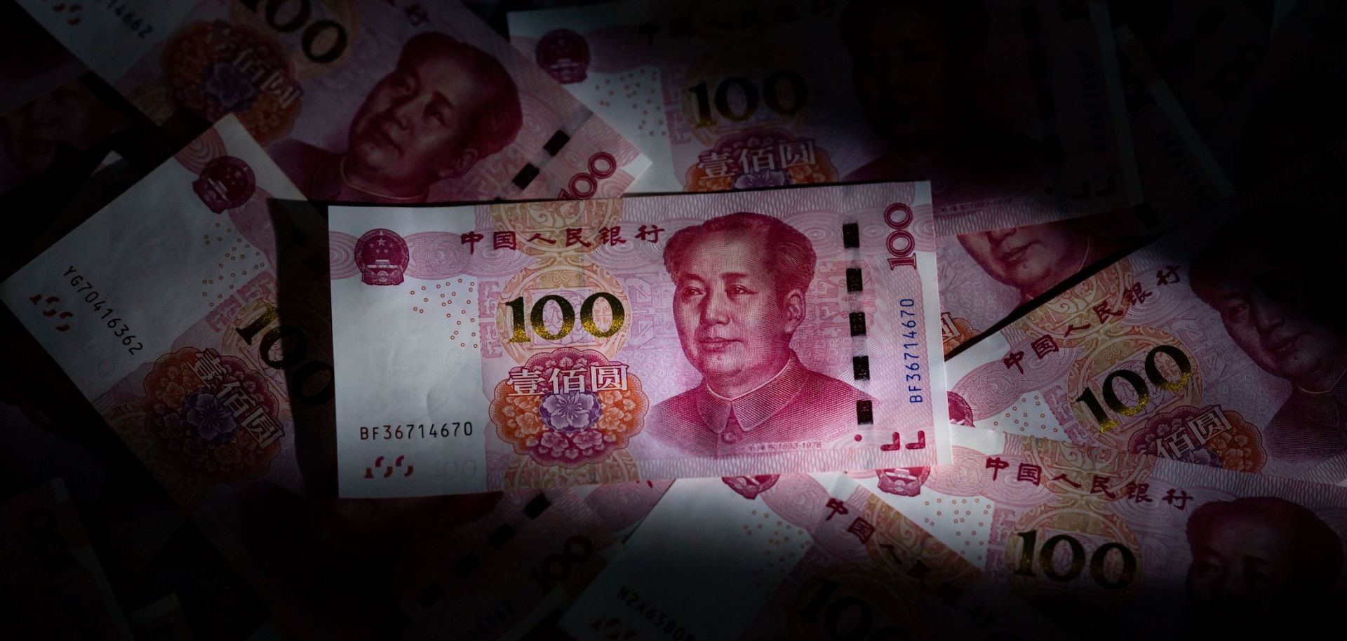 A photo illustration shows Chinese 100 yuan notes in Beijing on Jan. 14, 2020.  