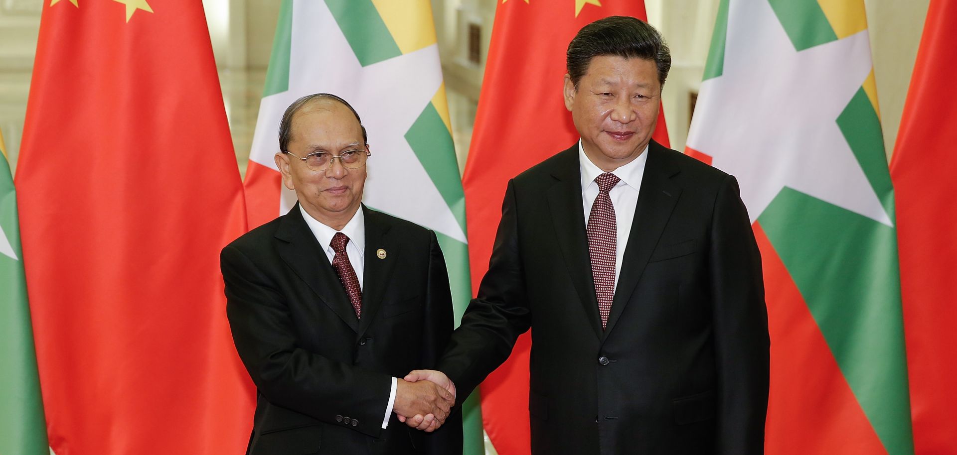 Chinese President Xi Jinping shakes hands with Myanmar's President Thein Sein at The Great Hall Of The People in Beijing, China. 