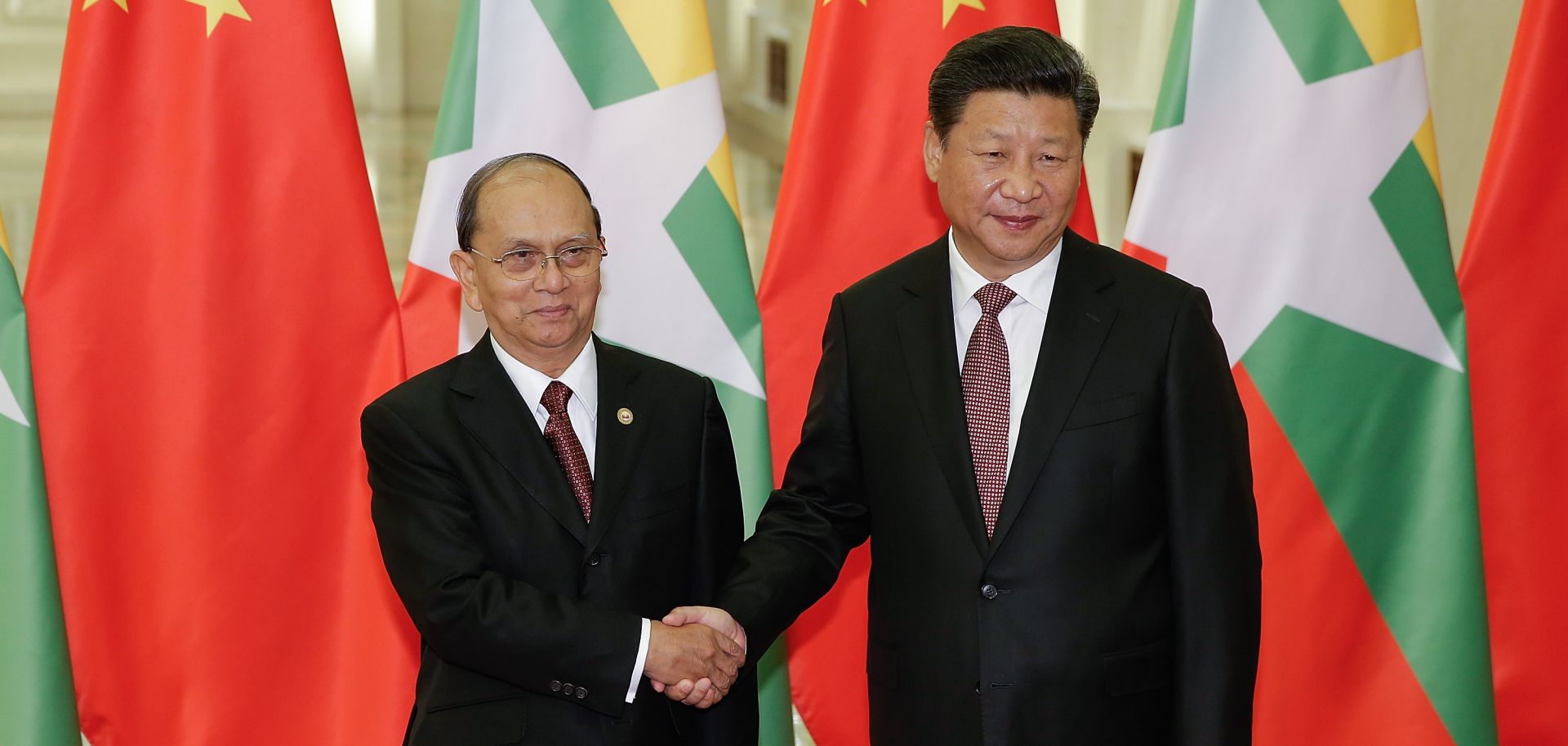 Chinese President Xi Jinping shakes hands with Myanmar's President Thein Sein at The Great Hall Of The People in Beijing, China.