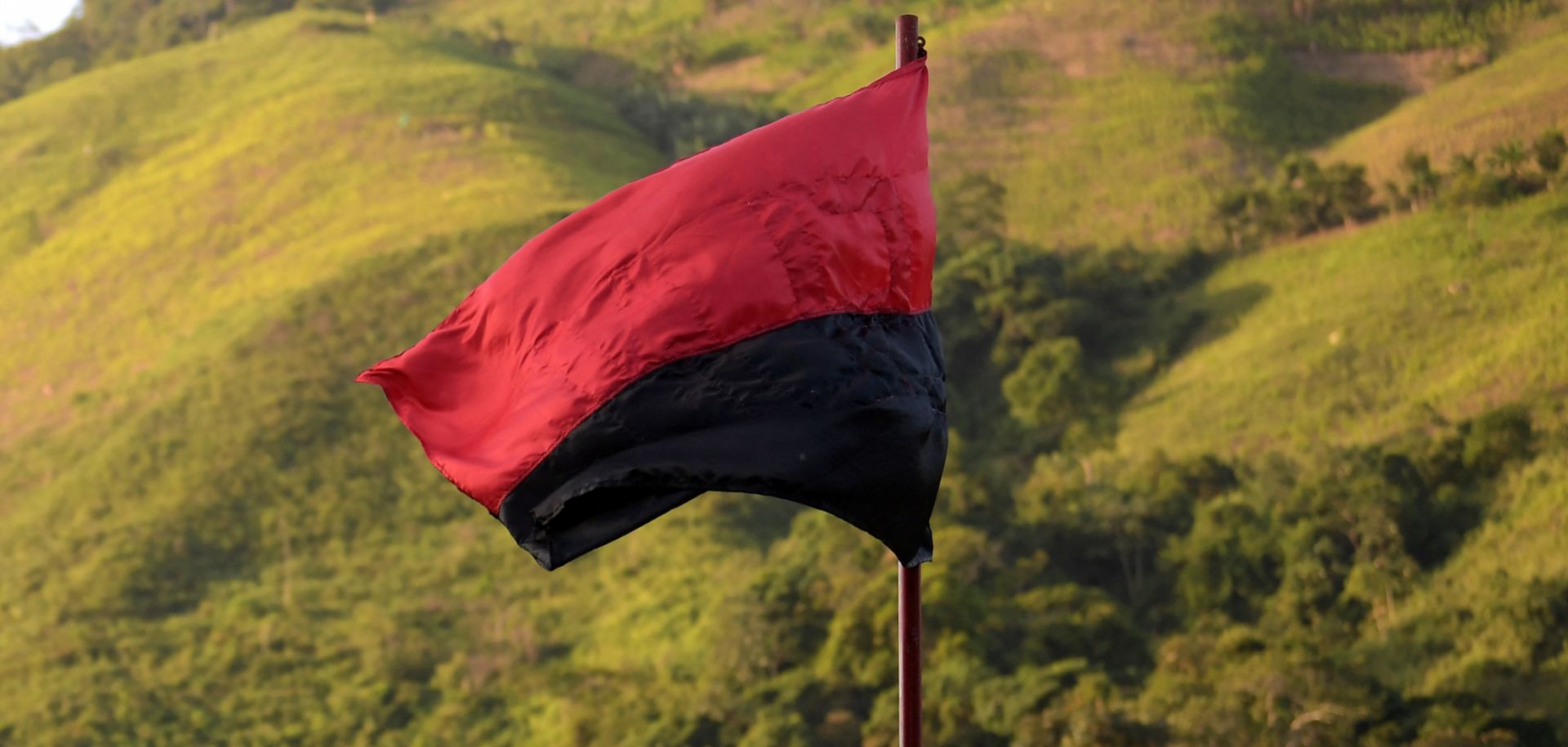 A flag of the National Liberation Army (ELN) guerrilla group flutters in the wind in Catatumbo, Colombia, on Aug. 18, 2022.