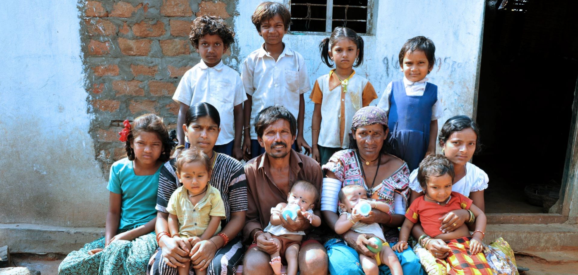 An Indian tribal couple poses with their 11 children in the Nalgonda district. For most of human history, high total fertility rates have been preconditions of national greatness, while low ones have been strategic suicide.