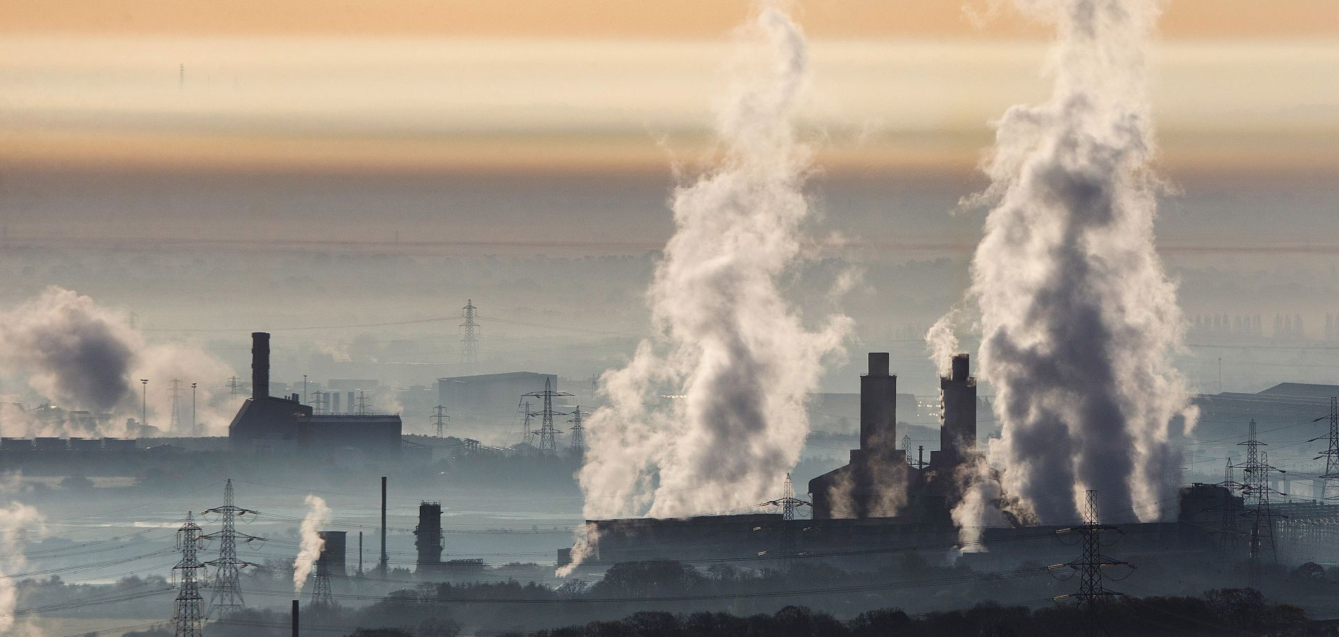 A power station in Wales belches steam into the morning sky.