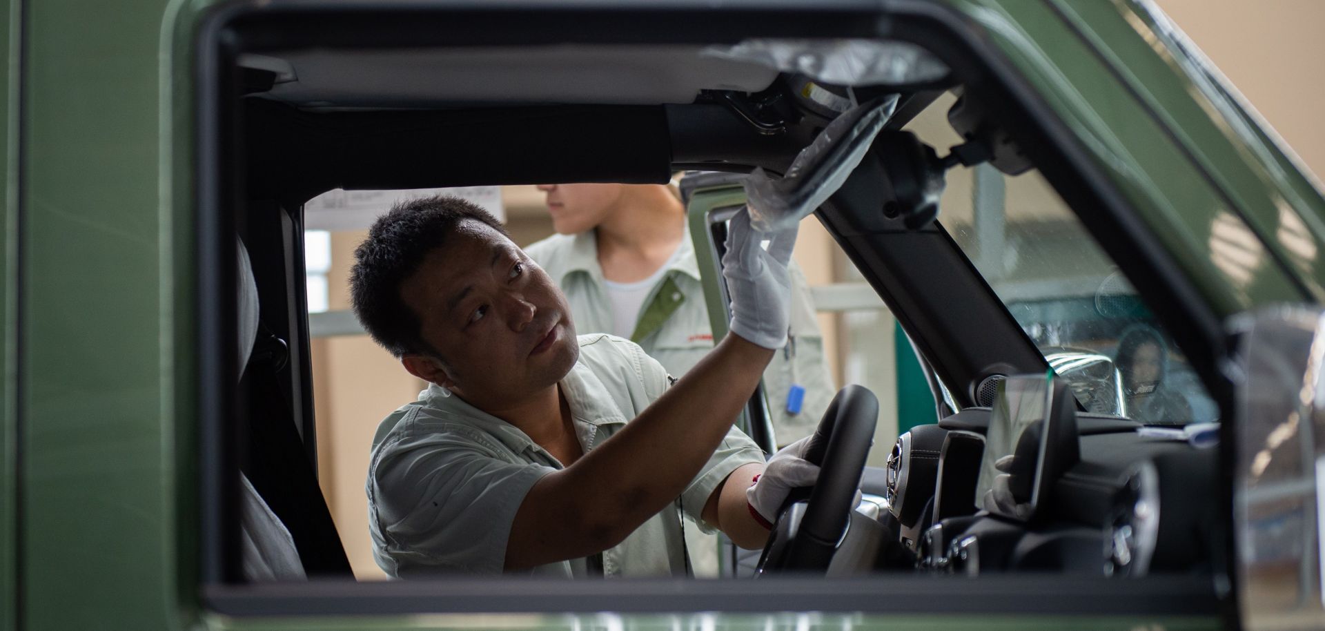 A Chinese autoworker is pictured on an SUV production line for the BAIC Motor Corp. on Aug. 29, 2018.