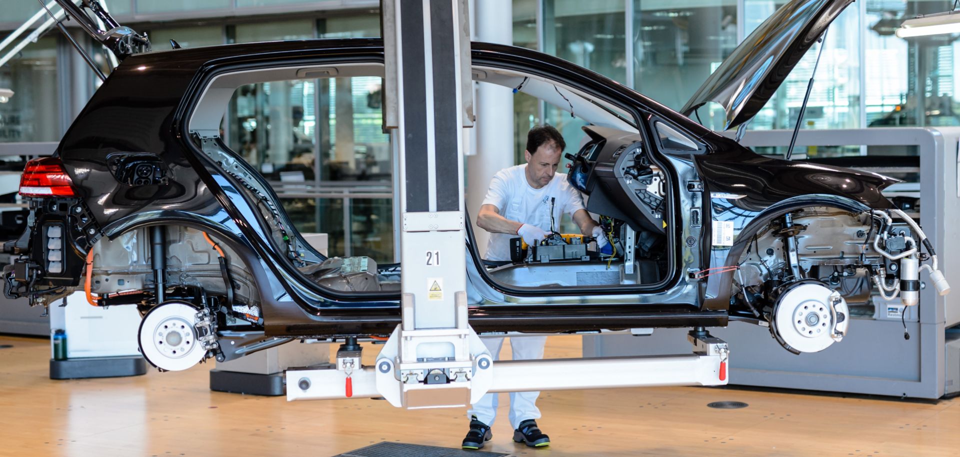 An employee works on a Volkswagen e-Golf electric automobile on the assembly line inside a factory on May 8 in Dresden, Germany.