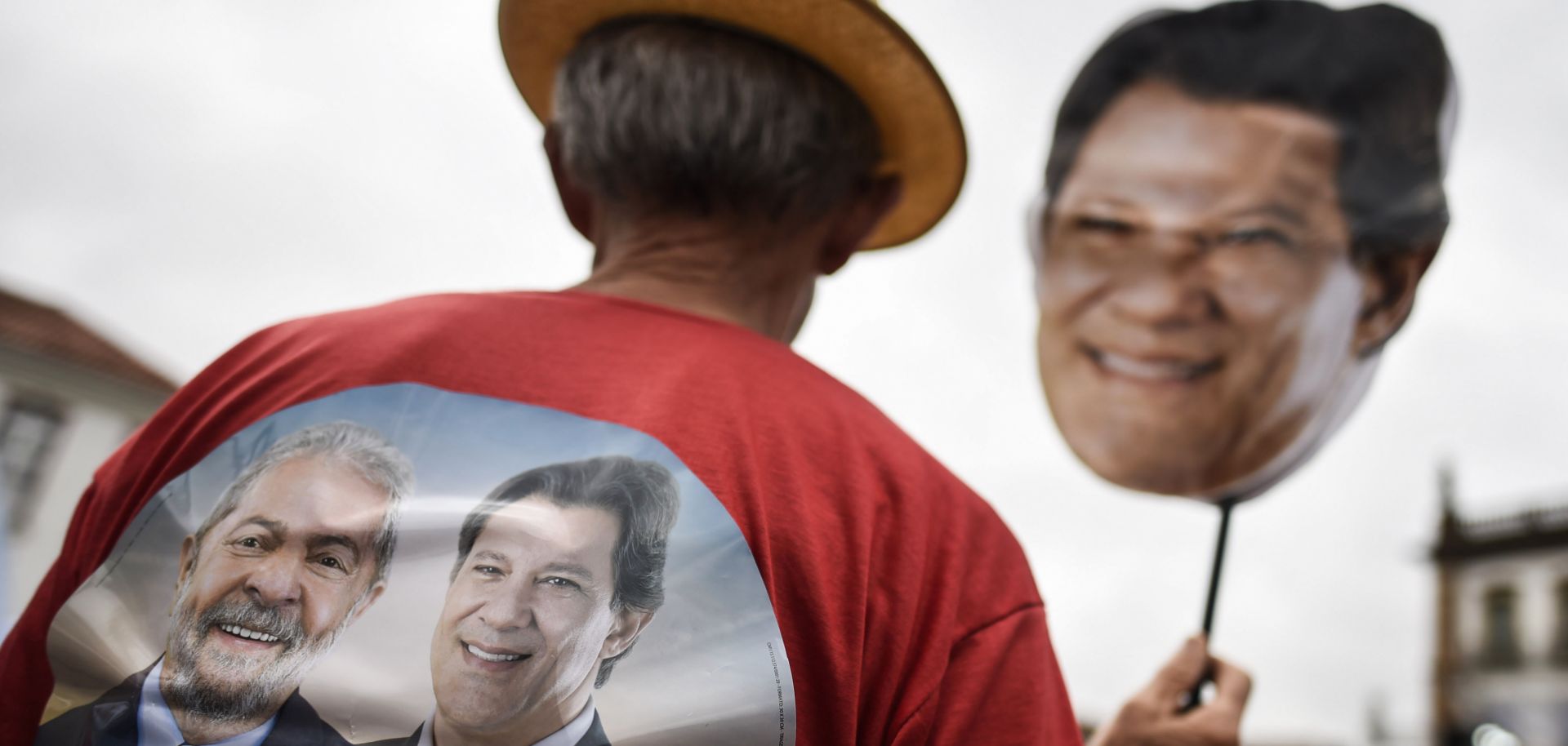 A Workers' Party supporter holds a mask with the face of Brazilian presidential candidate Fernando Haddad on it during a campaign rally in Ouro Preto, Minas Gerais, on Sept. 21 ahead of the Oct. 7 national election.