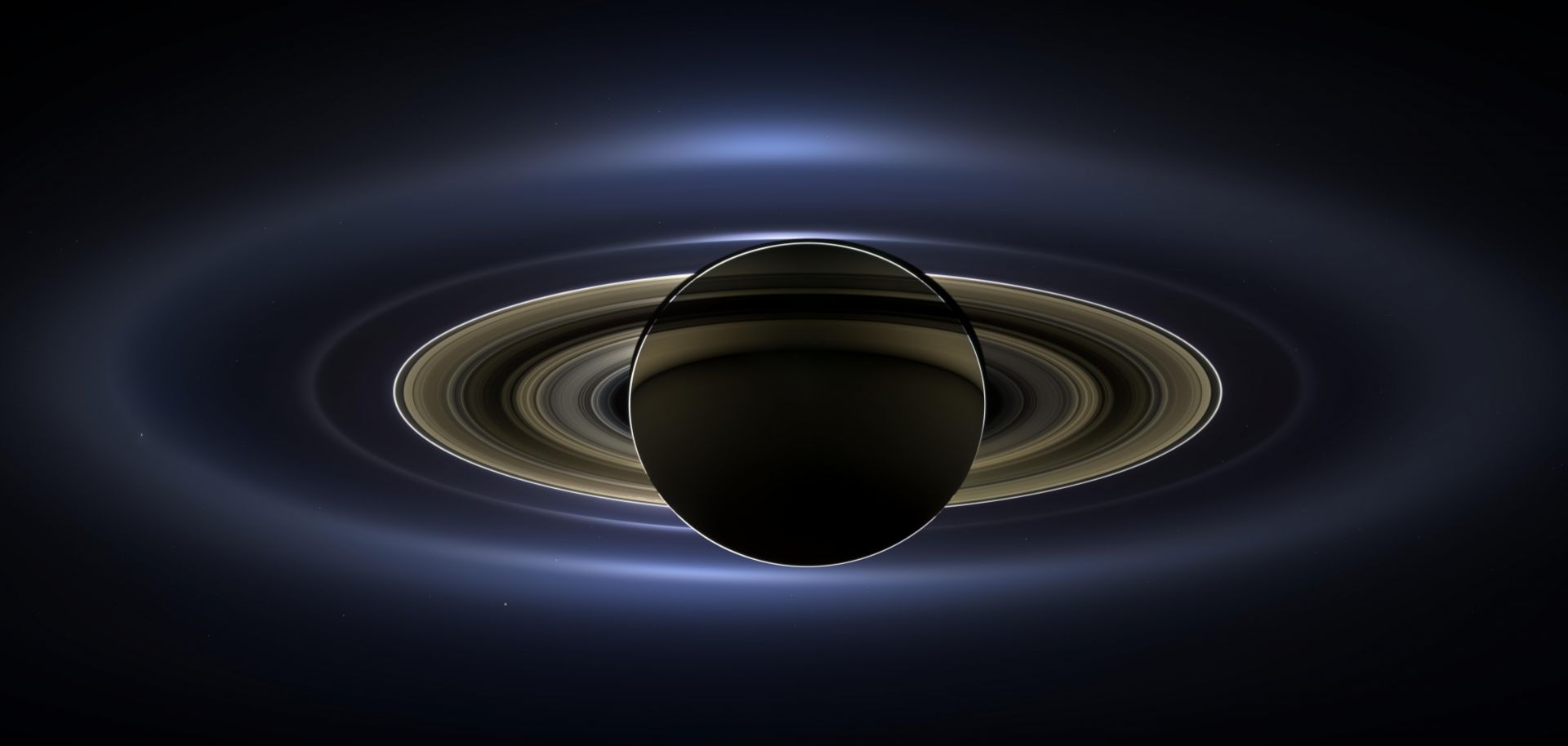 In an image sent from NASA's Cassini spacecraft July 19, 2013, the planet Saturn is backlit by the sun. 