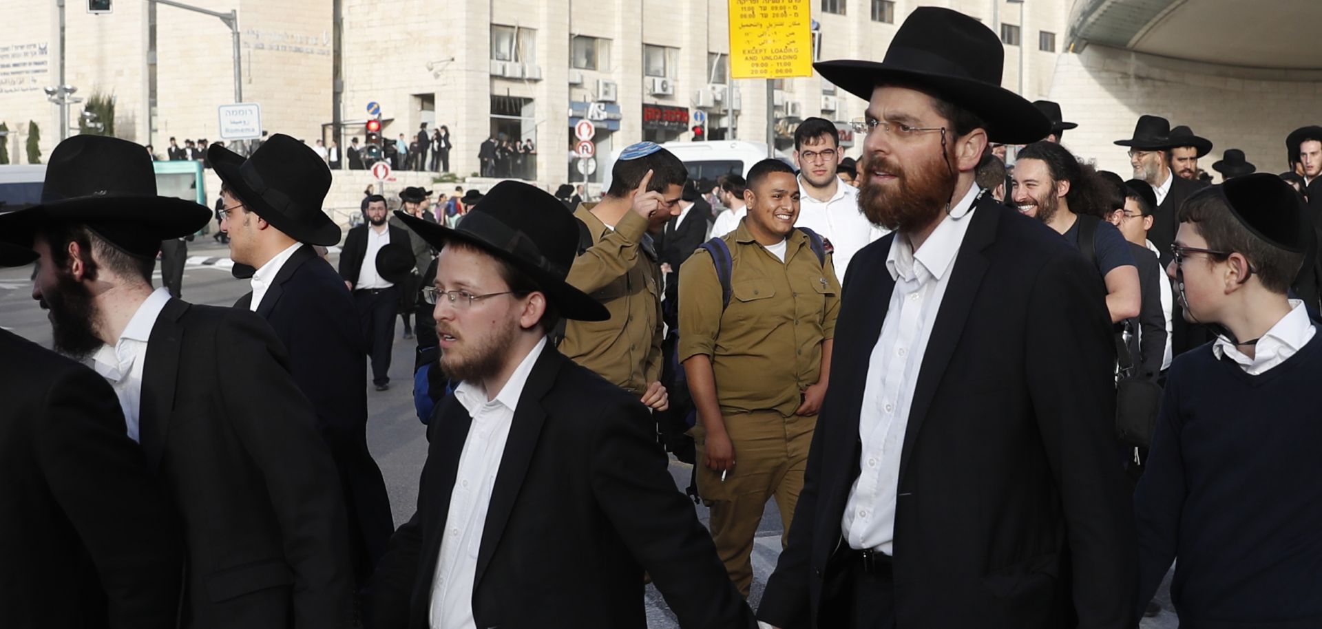 Israeli ultra-Orthodox Jewish men block a road as they take part in a demonstration against army conscription on March 8, 2018 in Jerusalem. 