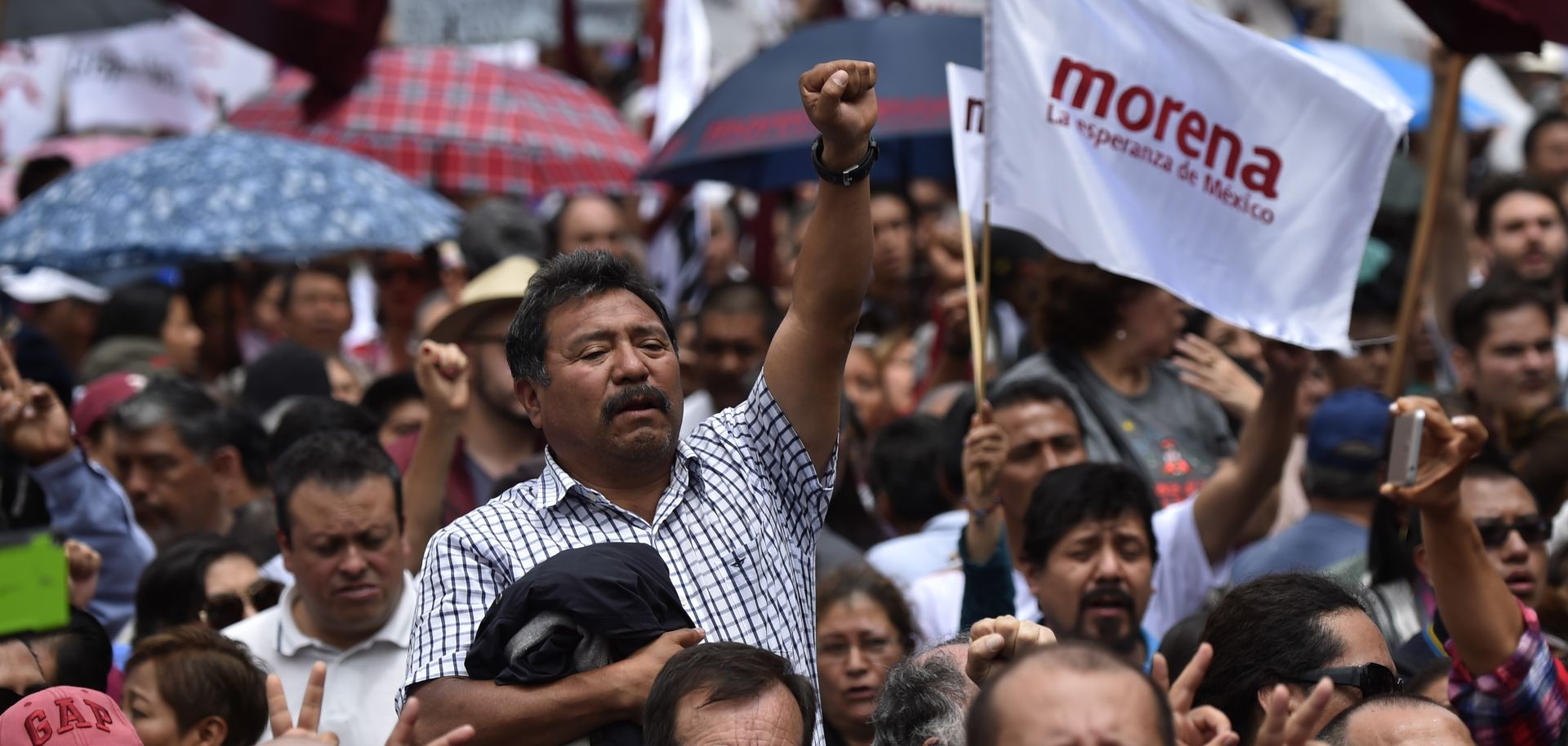 Followers of the National Regeneration Movement (MORENA) attend a speech given by Andres Manuel Lopez Obrador during a rally in Mexico City on Sept. 3, 2017.