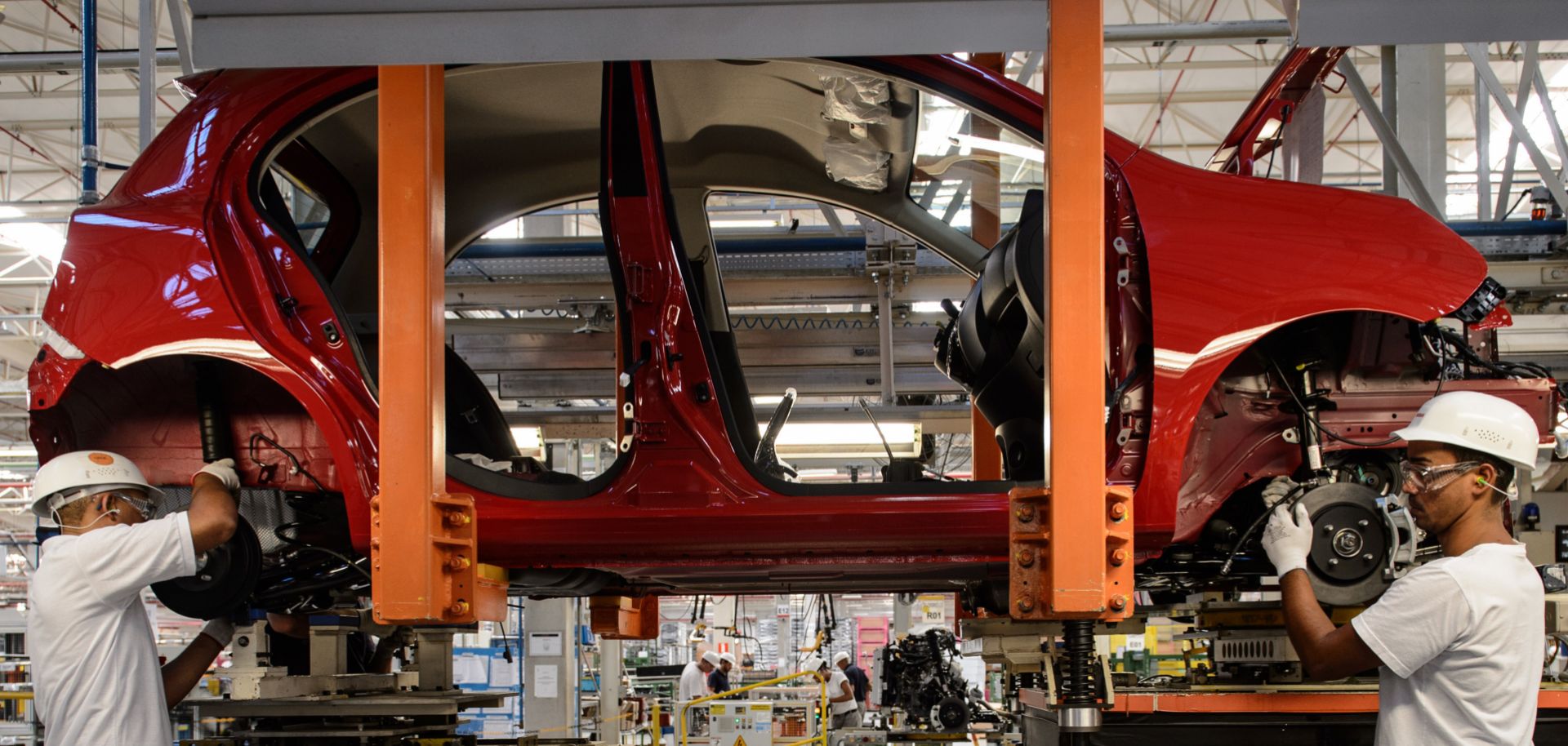 Workers assemble cars at the Nissan plant in Resende, Brazil, during February 2015. Most major automakers have factories in Brazil and Argentina.