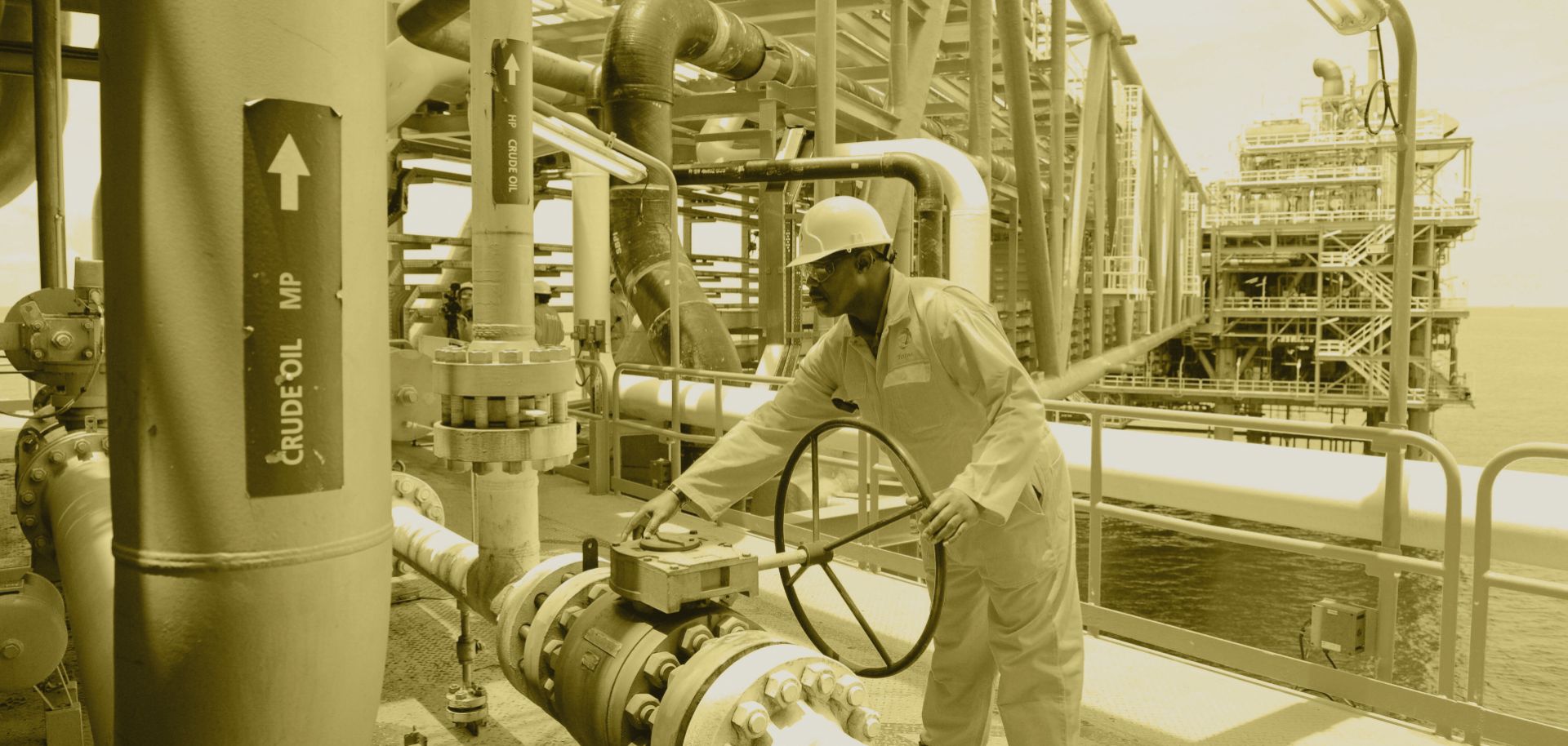 A worker inspects a Total oil drilling platform near Port Harcourt in the Niger Delta. 