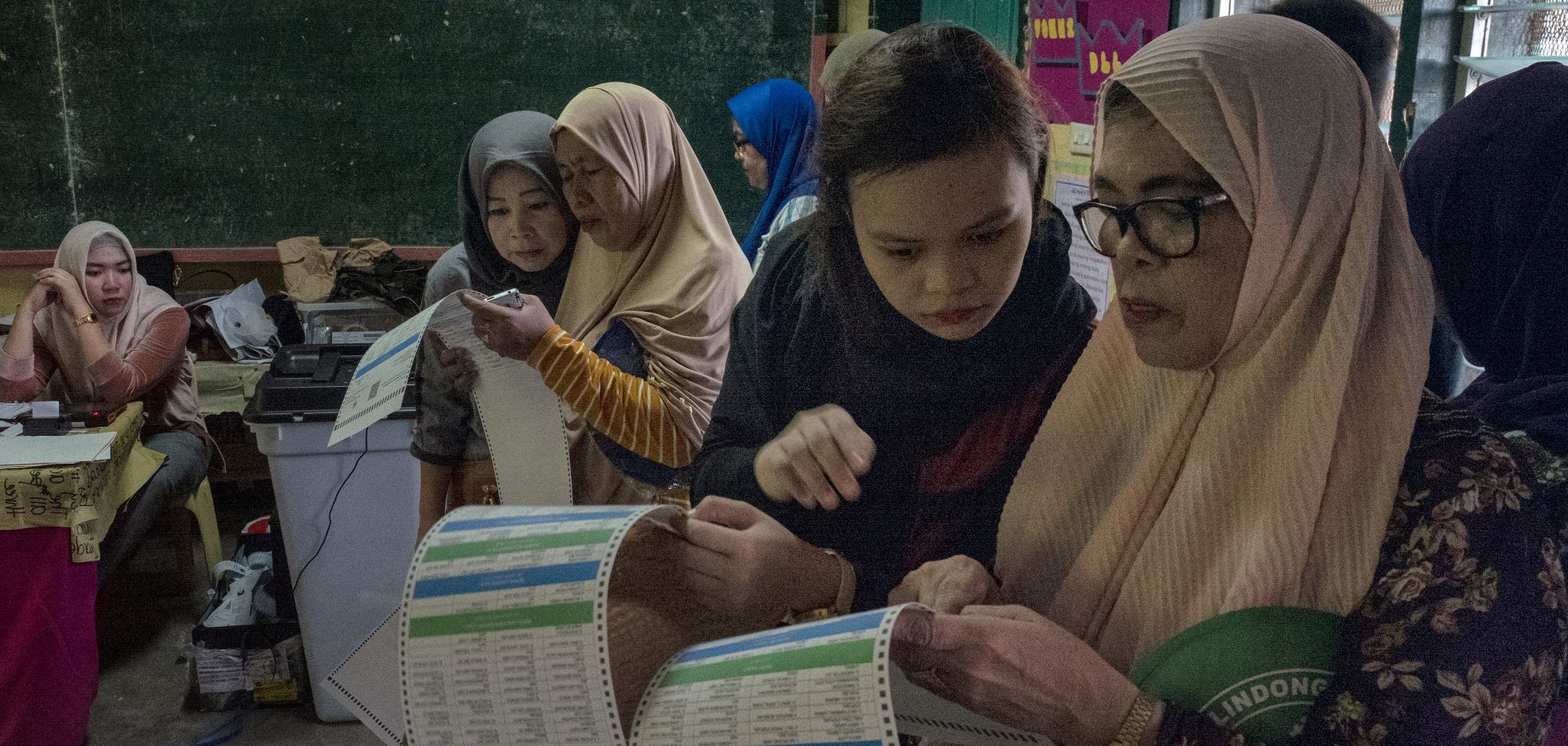 Residents cast their votes in Philippine national and midterm elections on May 13, 2019, in Malabang, Lanao del Sur, in the southern Philippines.