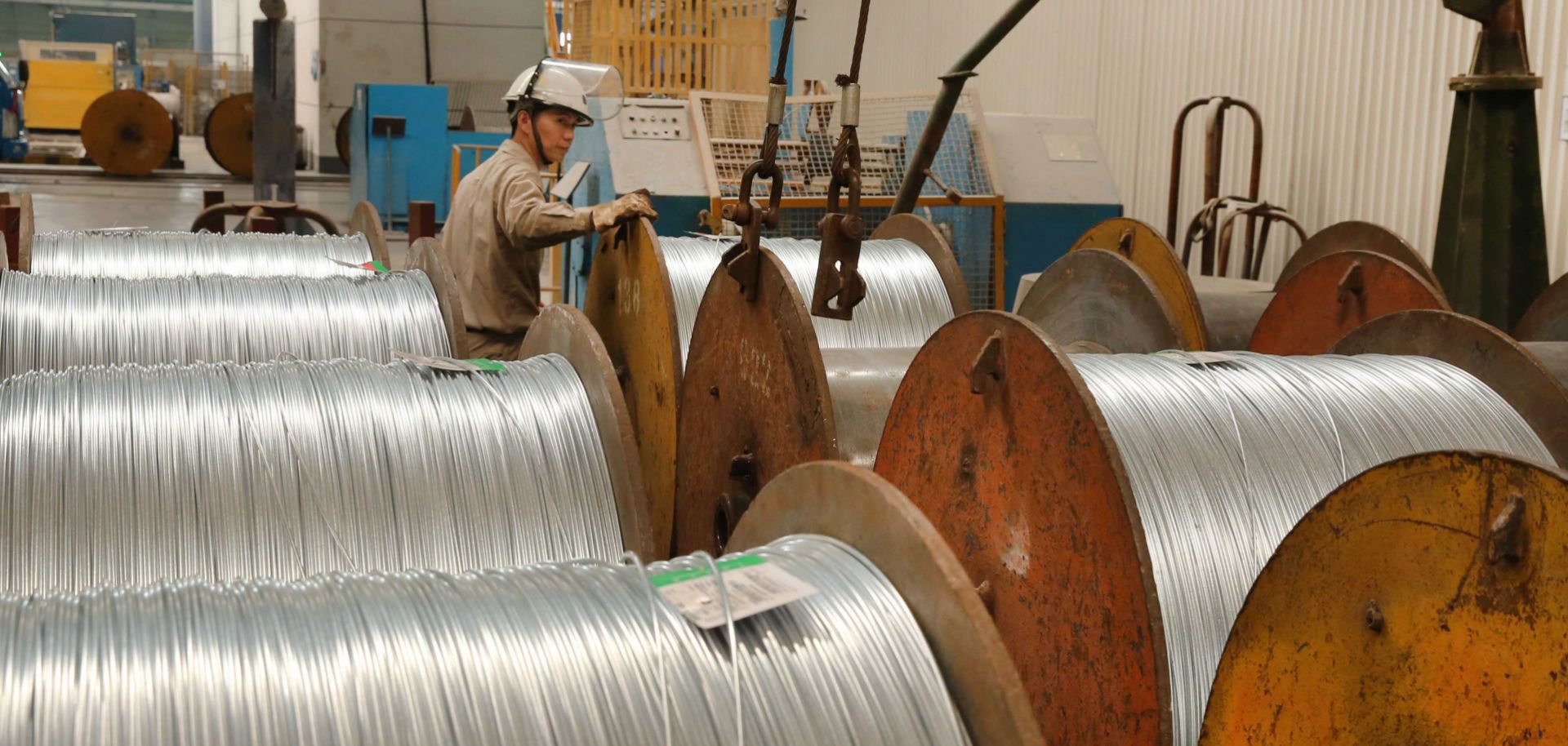 A worker handles steel cables at a factory in Nantong, China, on July 3, 2018.