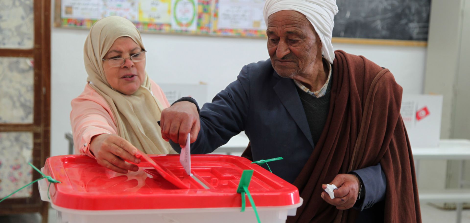 In this photograph, a Tunisian man casts his vote at a polling station during local elections in Kasserine in central Tunisia on May 6, 2018. 