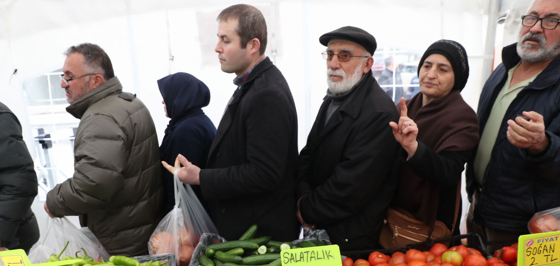 People line up to buy discounted vegetables sold by municipal authorities in Ankara, Turkey, on Feb. 13, 2019.