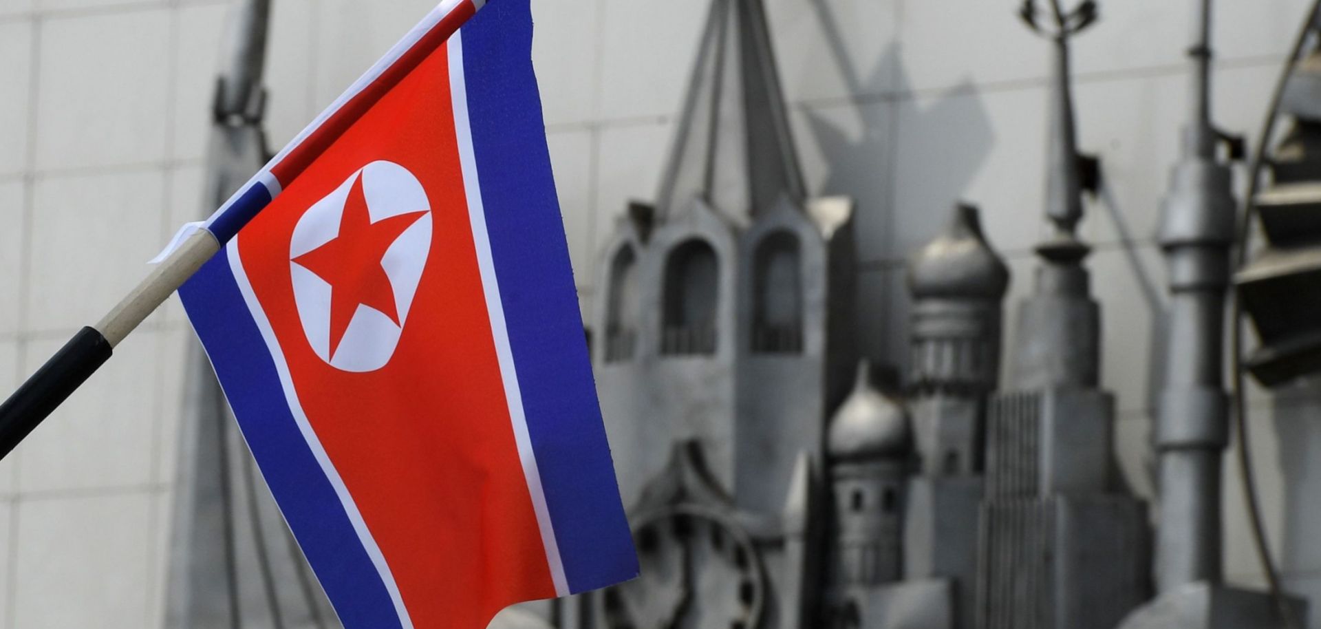 A North Korean flag is seen fixed on a lamp post in the far-eastern Russian port of Vladivostok on April 25, 2019. 