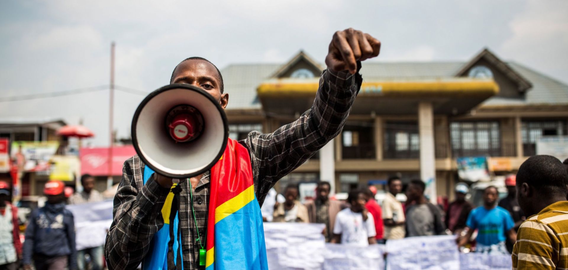 A supporter of the DRC’s citizen movement speaks at a demonstration