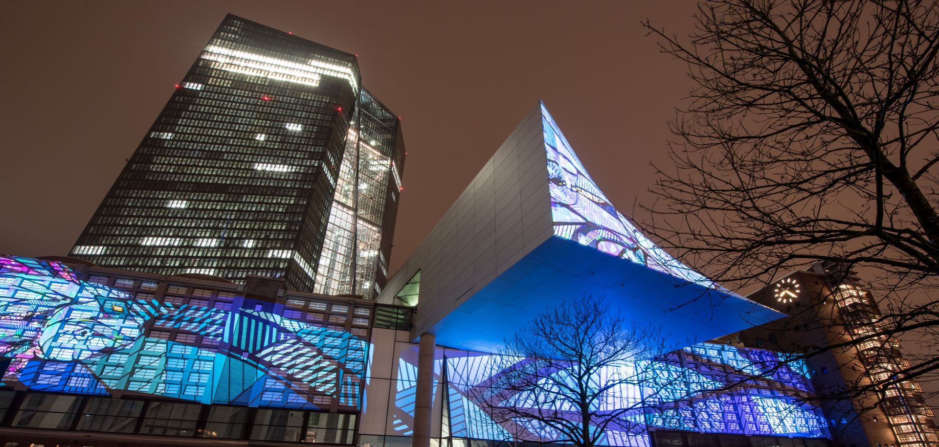 The historic facade of Frankfurt's Grossmarkthalle, now part of the building of the European Central Bank (ECB), is illuminated on March 16, 2018.