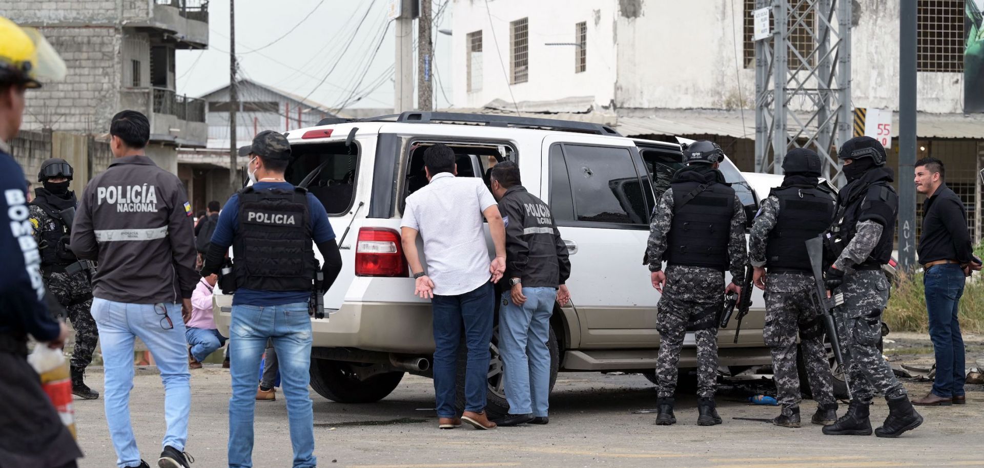 Policemen guard the car of Mayor Luis Chonillo after an attack on the official May 15, 2023, in Duran, Ecuador.