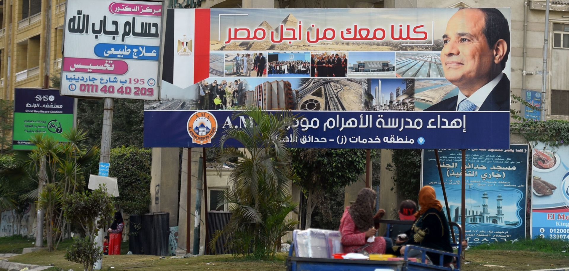 A billboard in Cairo touts the re-election of President Abdel Fattah al-Sisi. As elections approach in March, his opponents from across the political spectrum have found themselves under pressure from the country's military council.