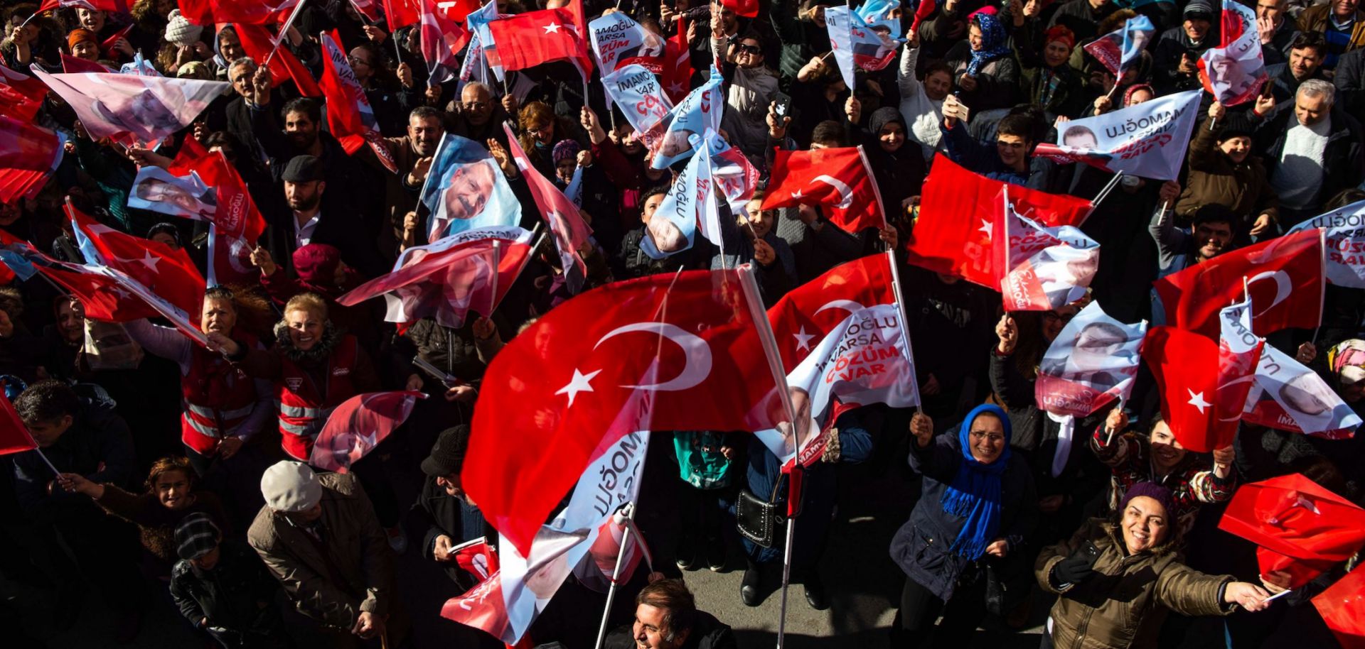 Supporters of the main opposition Republican People's Party's (CHP) mayoral candidate in Istanbul, Ekrem Imamoglu, wave flags during a rally ahead of upcoming local elections on March 29, 2019.