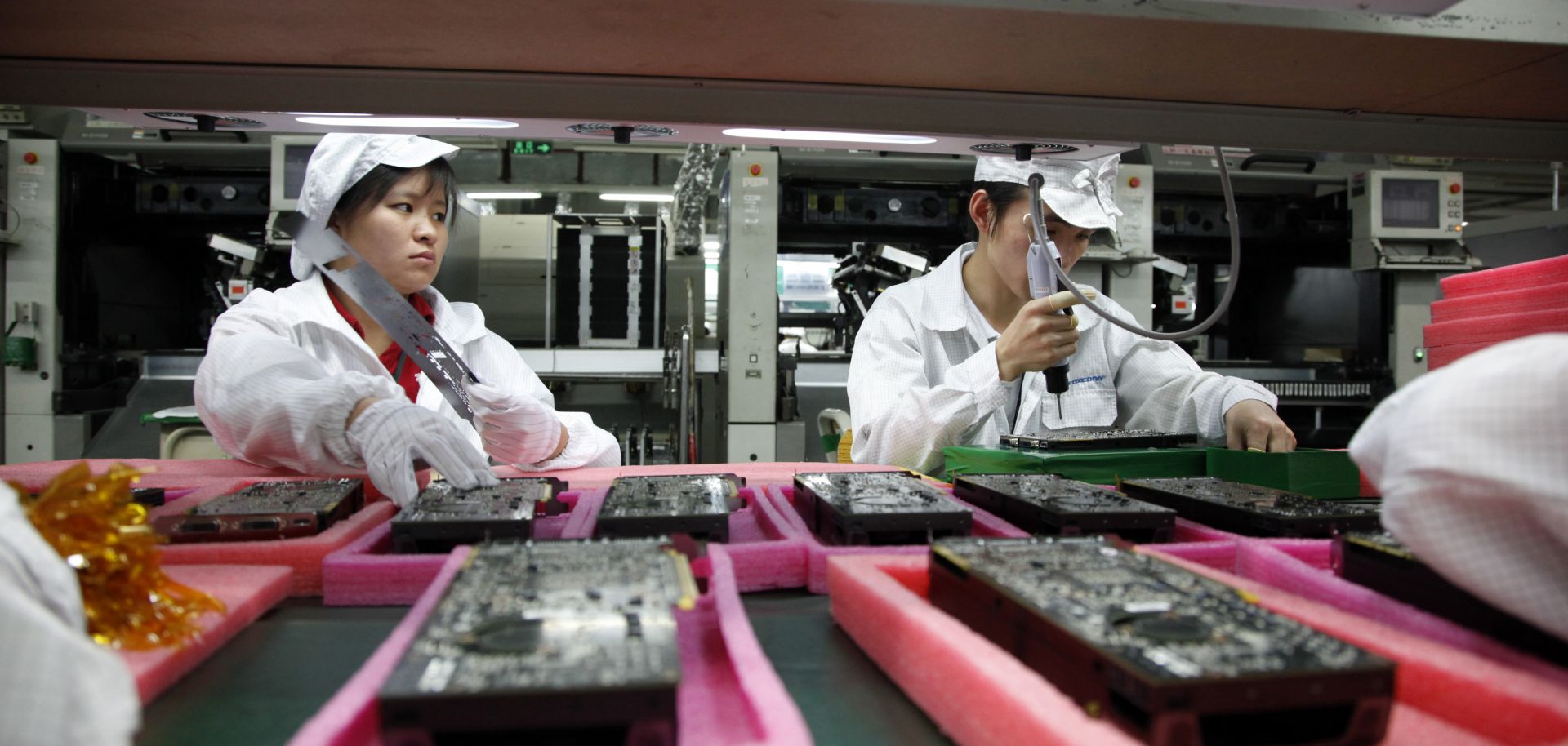 Employees work on the assembly line.