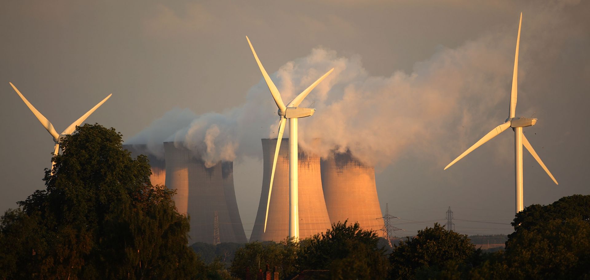 Wind turbines spin alongside the Drax power station, the biggest coal-fired plant in Europe.
