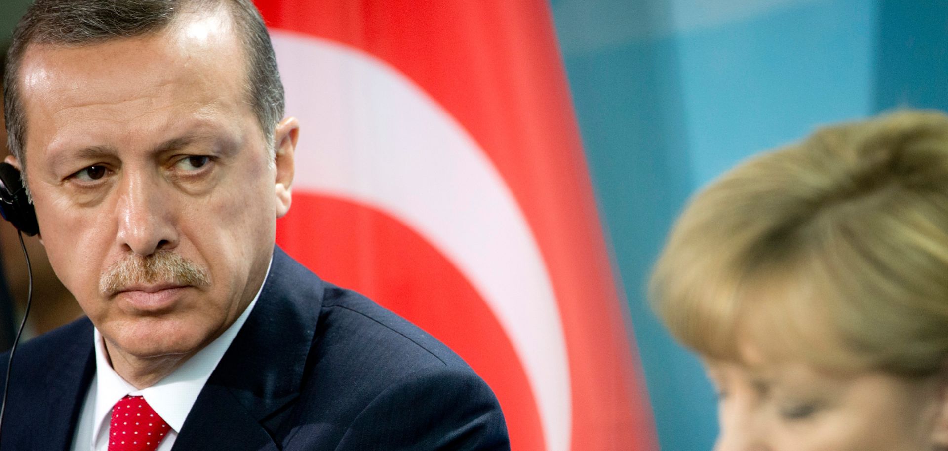 German Chancellor Angela Merkel (R) and Turkish President Recep Tayyip Erdogan hold a press conference in Berlin.