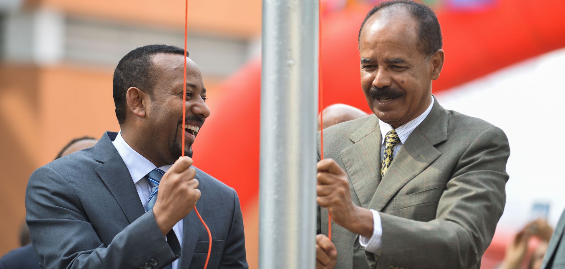 Abiy Ahmed (L), Ethiopia's prime minister, marks the reopening of the Eritrean Embassy in Addis Ababa on July 16, 2018, alongside Ertirea's president, Isaias Afwerki (R).