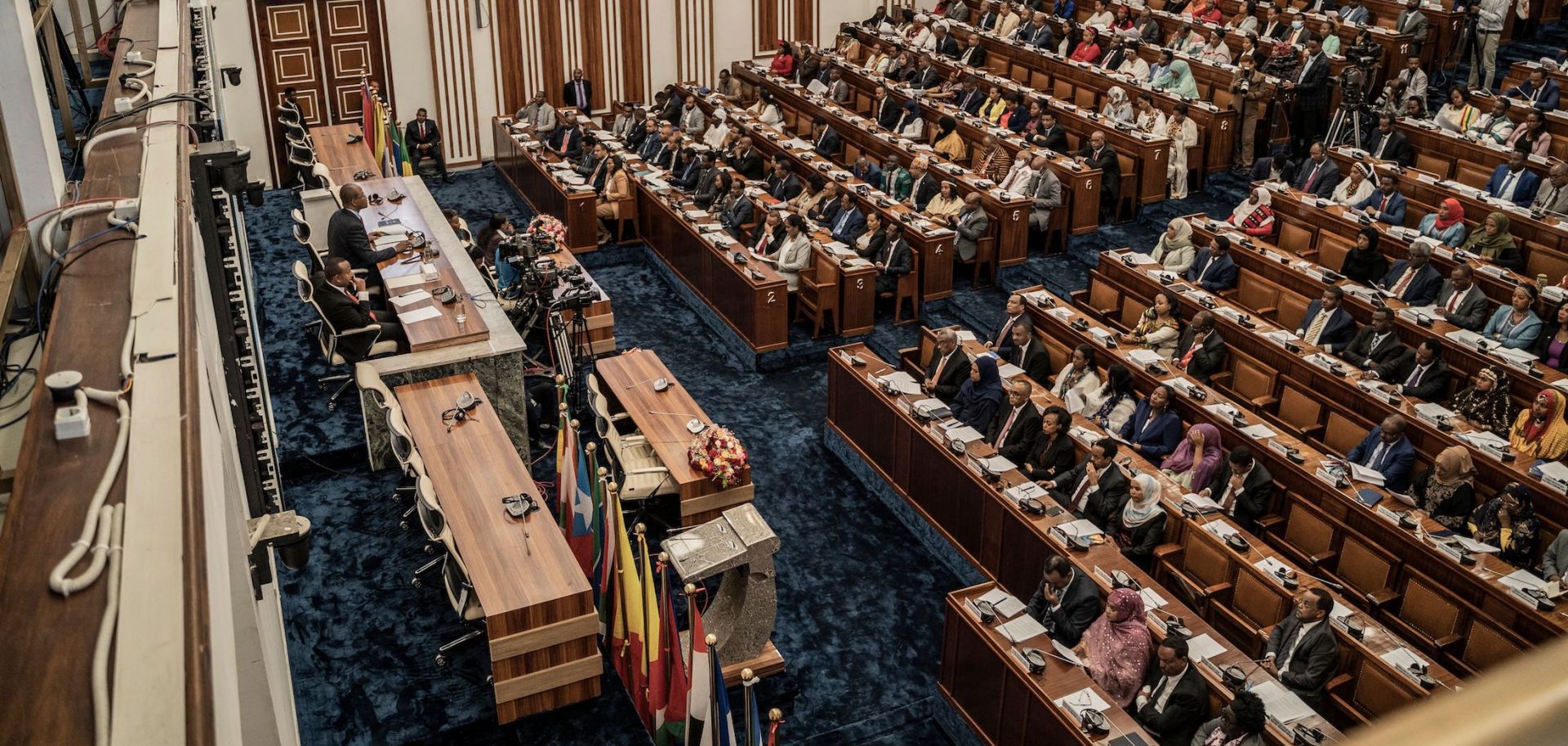 Ethiopian Prime Minister Abiy Ahmed (left) addresses lawmakers in parliament in Addis Ababa, Ethiopia, on March 28, 2023. 