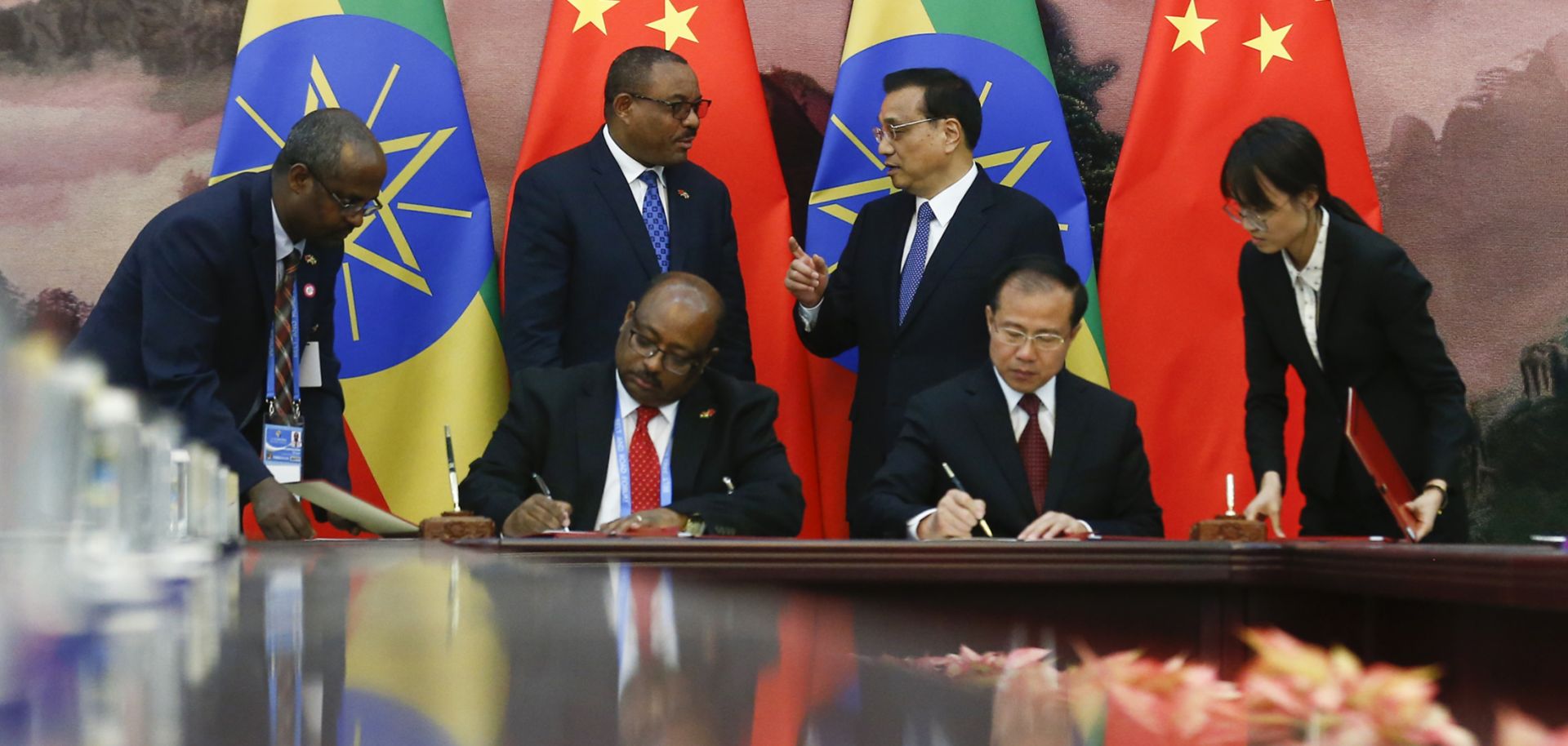Chinese Premier Li Keqiang and then-Ethiopian Prime Minister Hailemariam Desalegn attend a signing ceremony at the Great Hall of the People in Beijing on May 12, 2017.