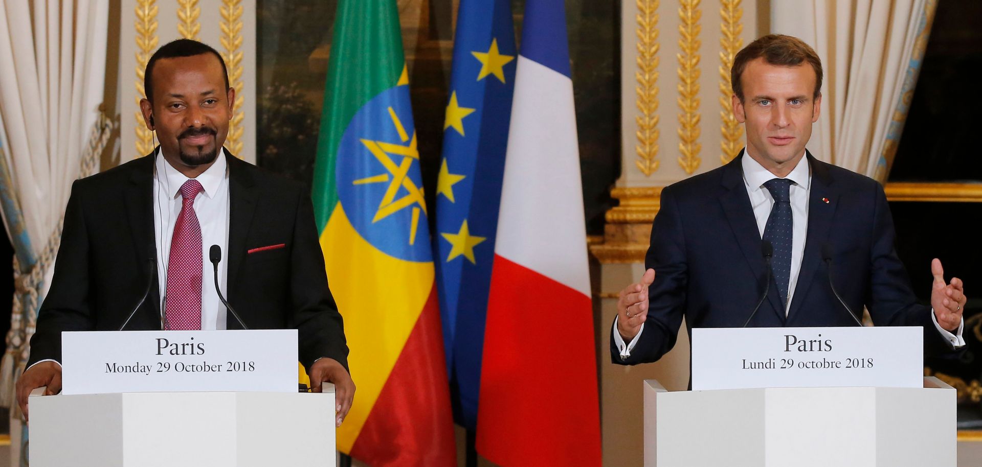 French President Emmanuel Macron gestures during a news conference with Ethiopian Prime Minister Abiy Ahmed in Paris on Oct. 29, 2018.