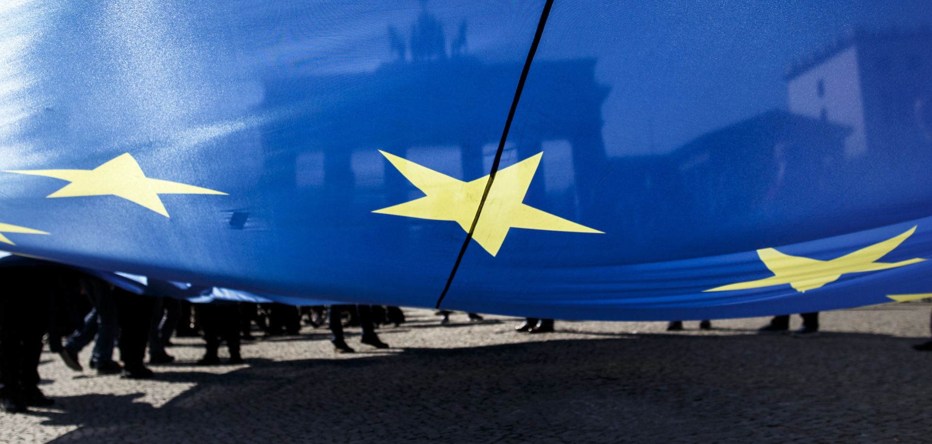 Supporters of the pro-EU movement Pulse of Europe wave EU flags as they gather in front of Berlin's Brandenburg Gate on April 8. 