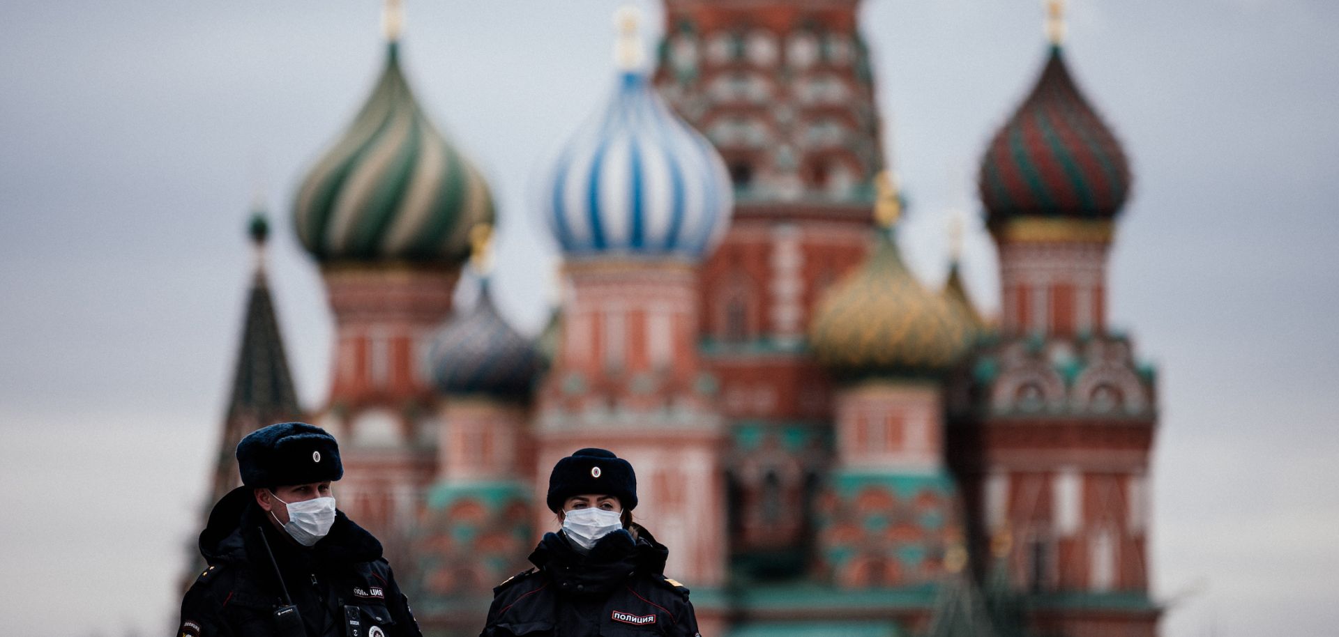 Russian police officers patrol Red square in front of Saint Basil's Cathedral in Moscow