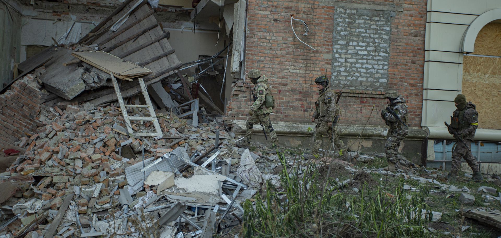 Ukrainian soldiers amid rubble of a building in Bakhmut, Donetsk Oblast, Ukraine. 