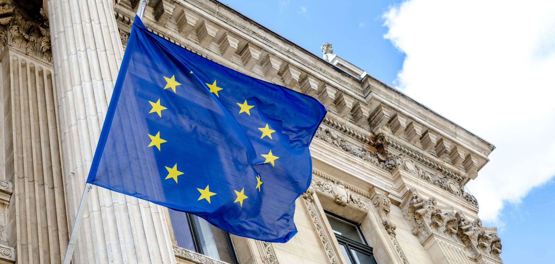 The EU flag flies over the stock exchange building in Brussels.