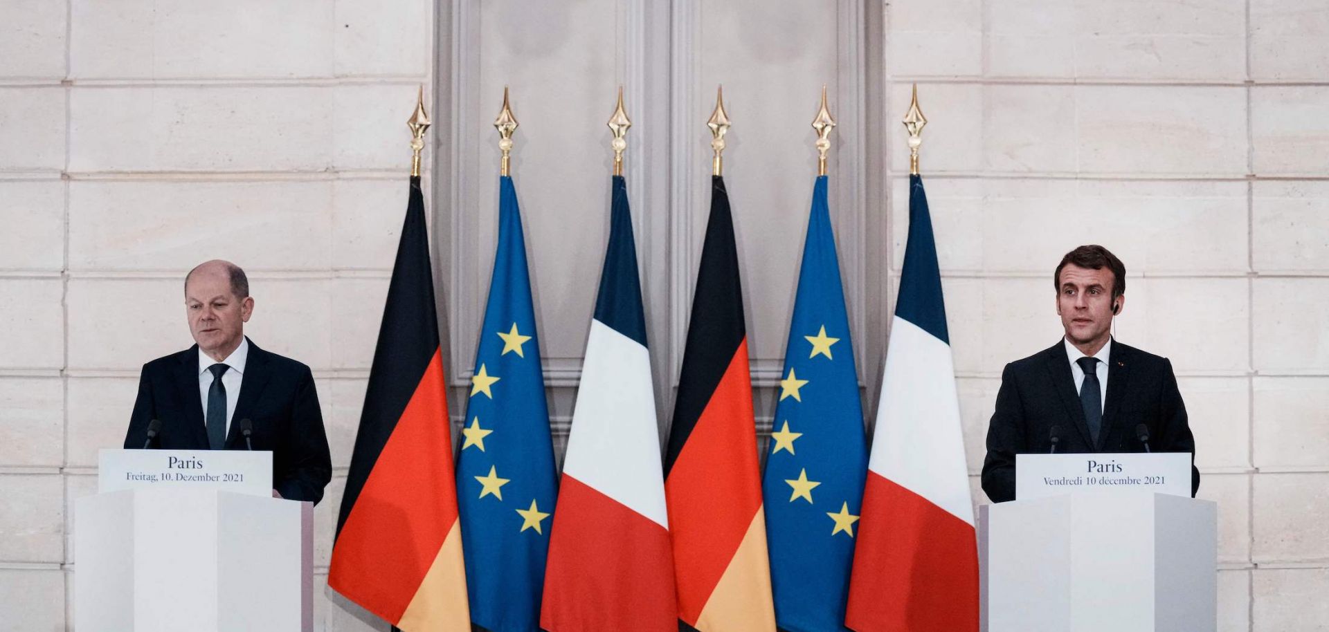 German Chancellor Olaf Scholz and French President Emmanuel Macron attend a media conference at the Elysee Palace in Paris